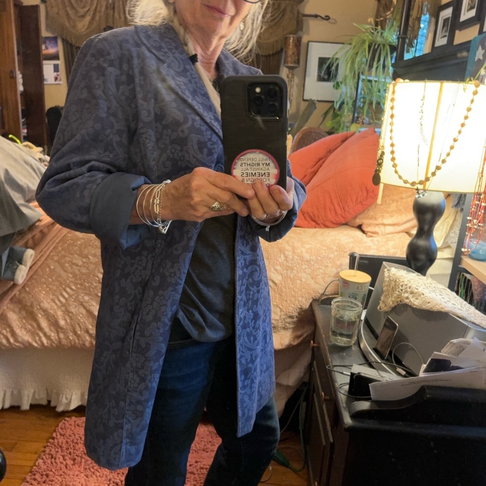 Corduroy jacket blue with vintage type design. Pockets. Looks great with jeans.
